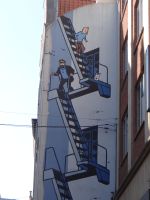 Brüssel, die Comicfiguren Tim und Struppi zieren eine Hauswand.  &ndash; &copy; Vivian Kreft (Eberhardt TRAVEL)