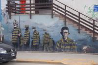Mural über die Gefangenen des Gefängnisses vom Ende der Welt. Rechts Cayetano Santos Godino, bekannt als el Petiso Orejudo (das Ohrenpony), Argentiniens erster Serienmörder