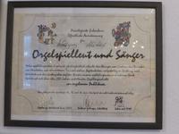 Urkunde in Hüttel's Musikwerkausstellung.