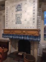 Ofen mit alten Seefahrermotiven auf den Porzellankacheln