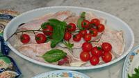 Fisch mit Tomaten beim Kochkurs