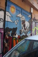 Der Vesuv als Harlekin,  einer seiner Gegenüber hält ihm ein Buch mit der Aufschrift „Verità“ (Wahrheit) entgegen.