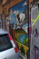 Der Vesuv als Harlekin,  einer seiner Gegenüber hält ihm ein Buch mit der Aufschrift „Verità“ (Wahrheit) entgegen.