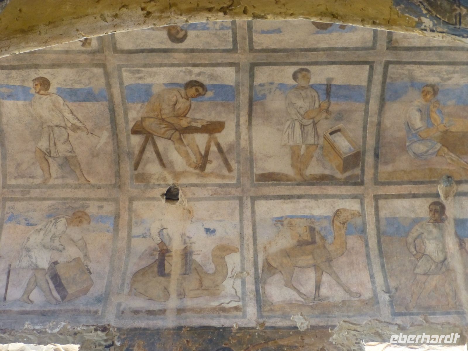 Verschiedene Berufe und darunter eine Karawane von Dromedaren. Vielleicht transportieren sie die Güter, die die Handwerker herstellen?