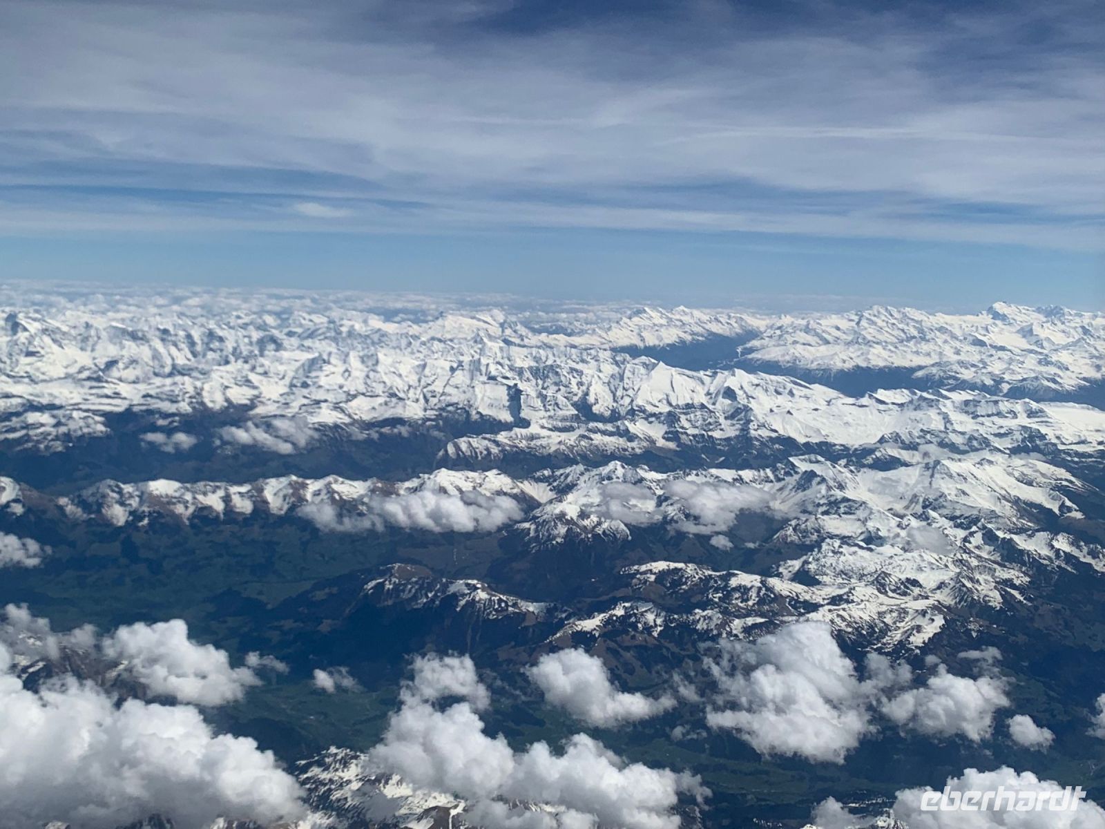 Blick auf die Schweizer Berge - Rückflug unserer Schweizerin