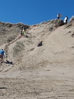 Sandsurfen am Ninety-Mile Beach, Neuseeland