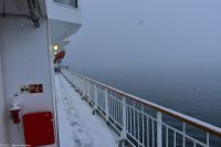 Einfahrt nach Tromsø - Direkt vor uns (wenige hundert Meter) die lange Tromsøya-Brücke und Eismeerkathedrale - völlig verschwunden im dichten Schneegestöber