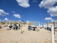 Sonnenanbeter am Strand von Caparica