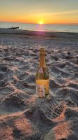 Begrüßungssekt am Strand