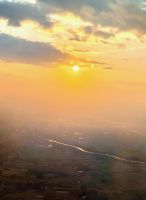 Sonne über der Isar vor München