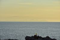 Wanderreise Menorca - Sonnenuntergang in Cala Blanca - Blick nach Mallorca