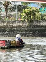173 Unterwegs im Mekong - Fischerfrau
