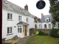 verputztes Guernsey-Haus