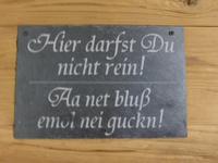 Auf Deutsch und auf Erzgebirgisch.