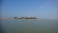 Landschaft mit Leuchtturm am Po