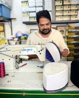 Hier werden die traditionellen Kopfbedeckungen mit der Hand gefertigt, Georgetown