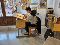 Miniaturenwerkstatt - Junge am Malen