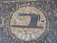 Ladenschild aus Rheinkiesel