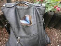 Der Schmetterling auf der Tasche